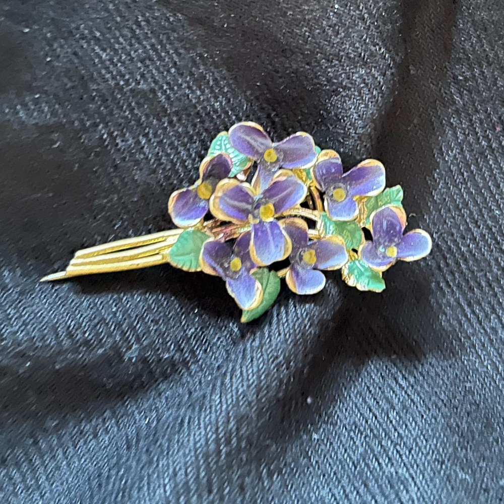 Dainty enamel brooch featuring violets. Made in Austria.